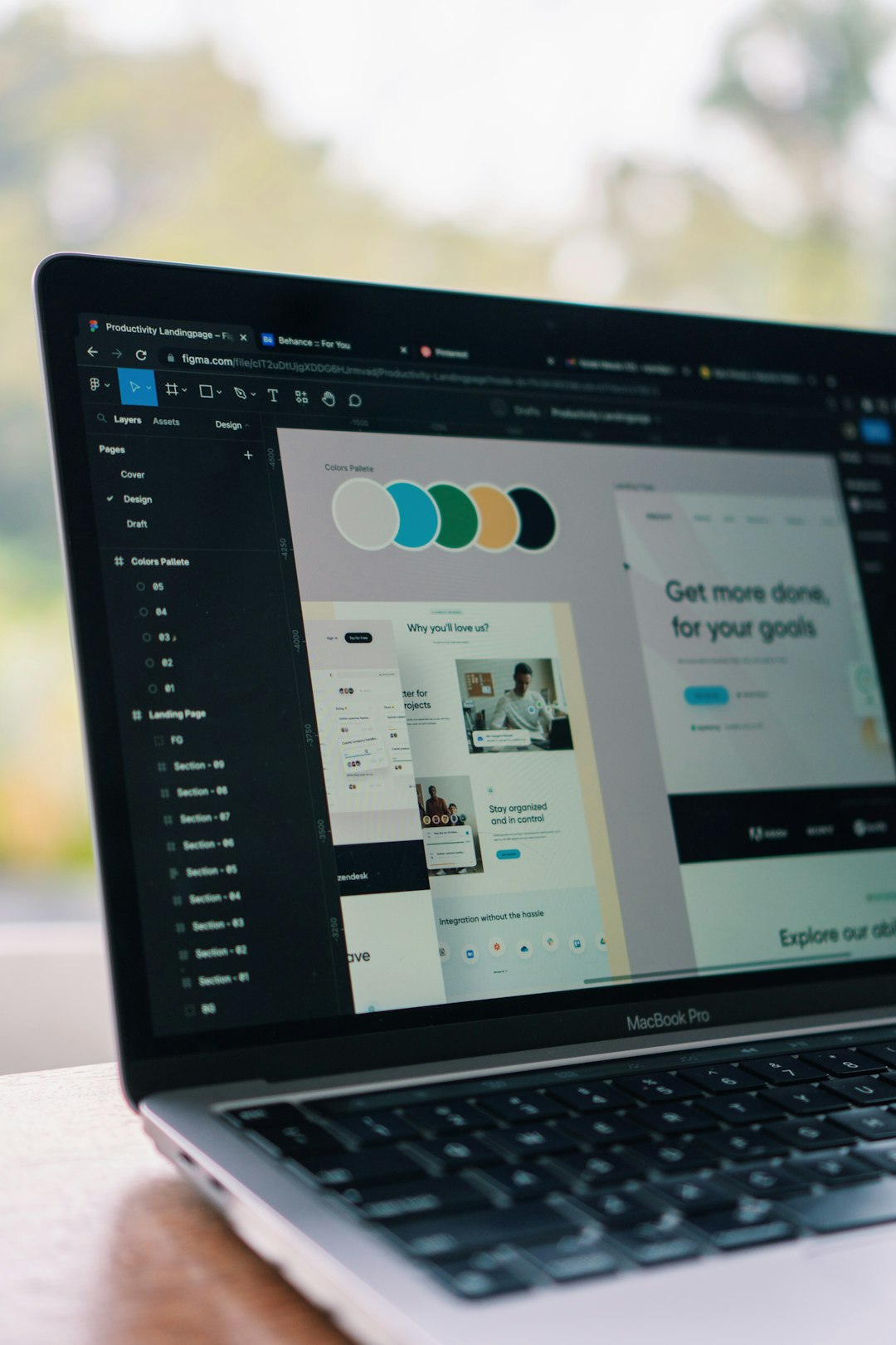 a-laptop-computer-sitting-on-top-of-a-wooden-table-qb5frk87w1g